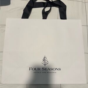 White Four Seasons shopping bag with Black Handles